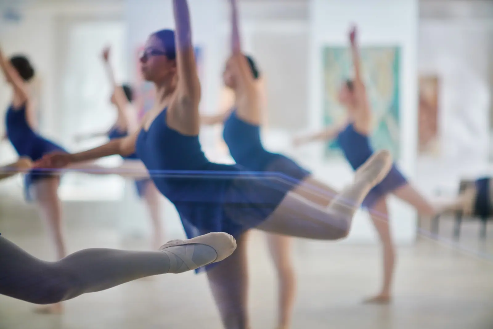 Dancers stretching their legs during the Dimension of the Heart performance