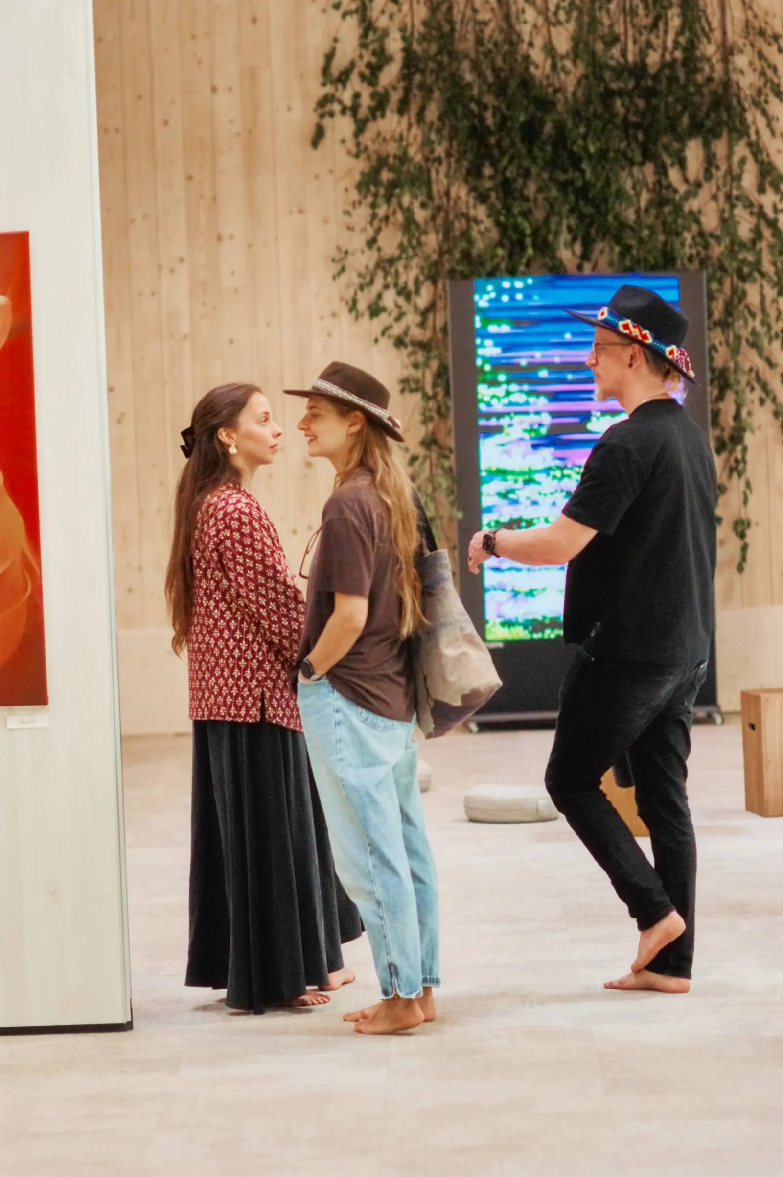 Visitors gathered beside a video screen at Nuoramos