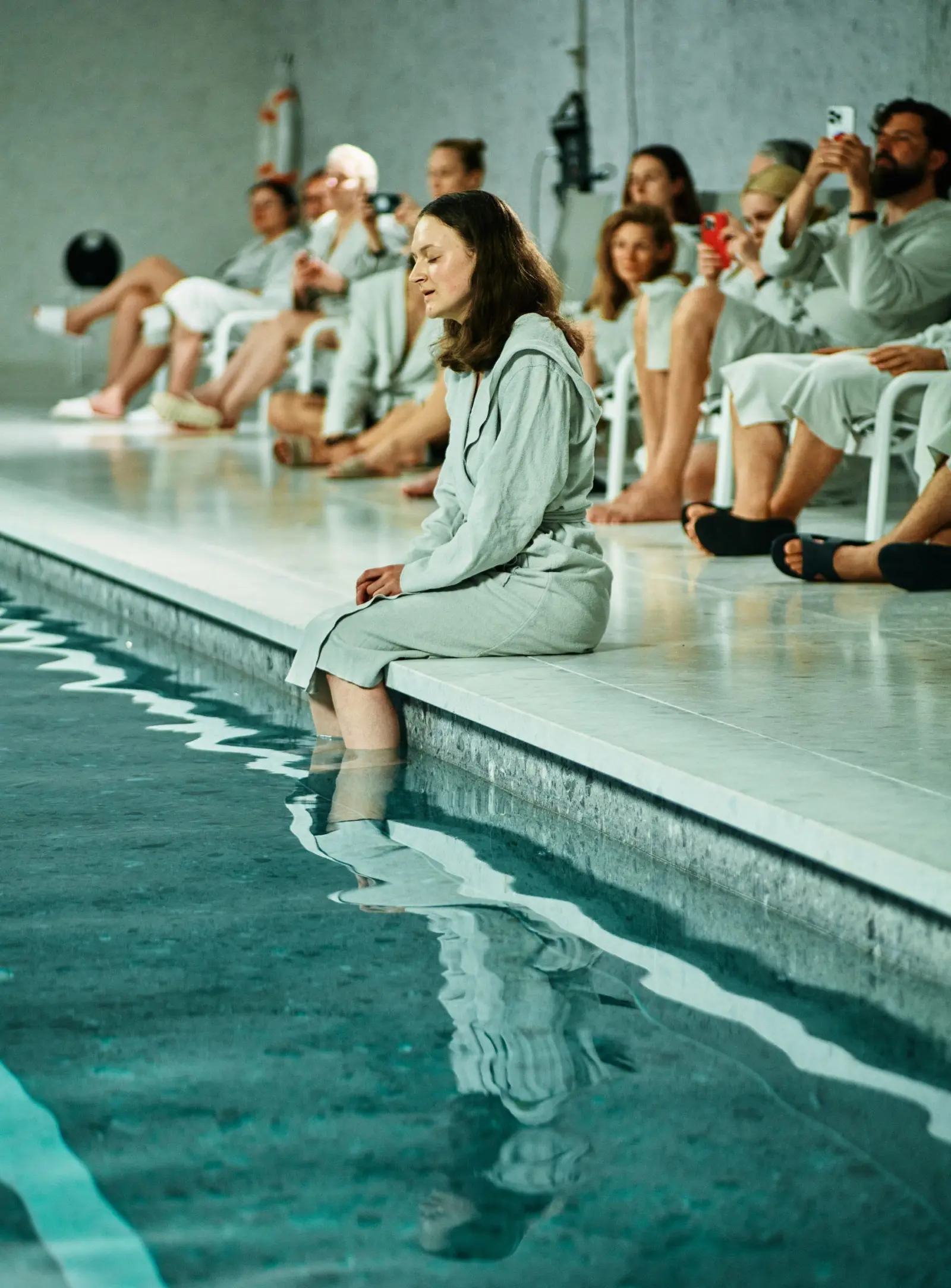 Audience seated along the pool at Bokšto SPA