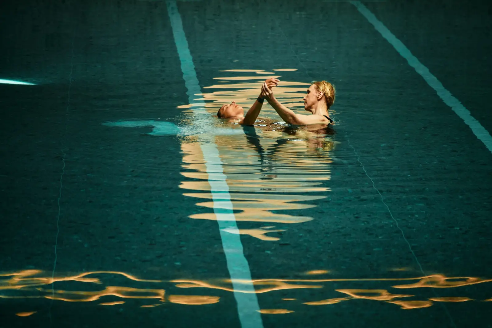 Two participants floating together during Water Body